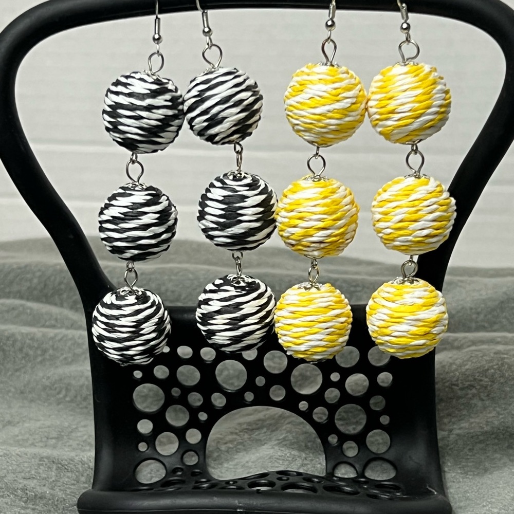 2 Beautiful pairs of yellow/ white and black/ white Lantern style earrings.